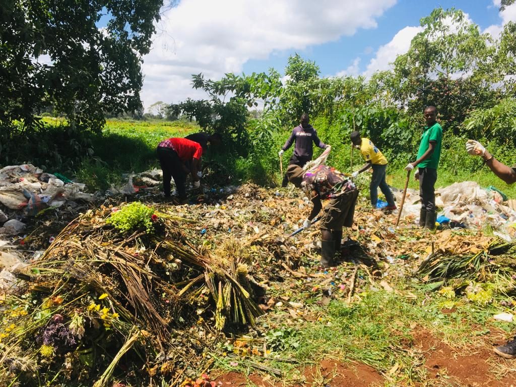 Community members clearing and rehabilitating a degraded site as part of the restoration work